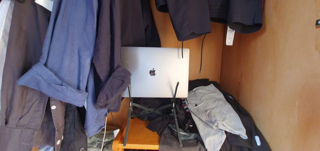 MacBook Pro resting in the wardrobe